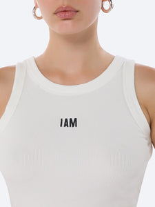 Close Up Detail view of the I AM ME TANK WOMEN WHITE  by IAM ACTIVESTUDIOS, showcasing its sleek design and embroidery logo detail.