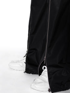Close-up Detail of Unisex Black Signature Zipper Trousers, Urban Fashion